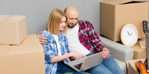 Couple with Moving Boxes Stock Photo